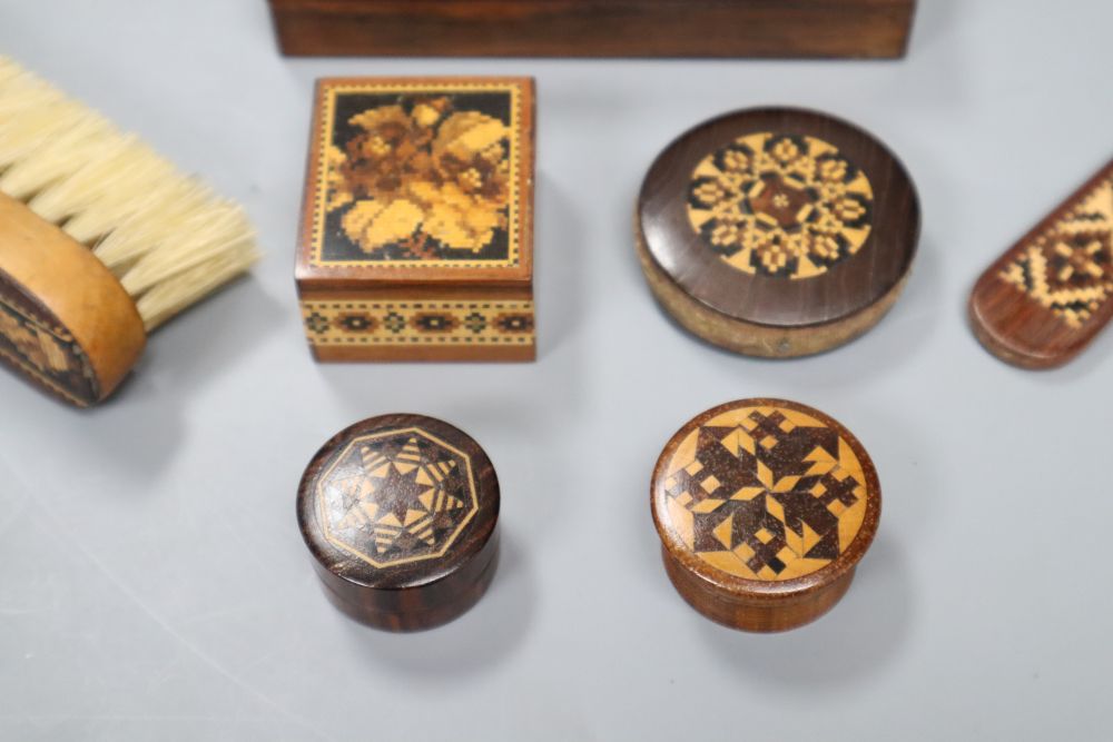 A Tunbridge Ware disc pin cushion, three small boxes, stamp box, two pill boxes, a paper knife and a clothes brush